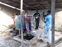 Ireti Emmanuel Adesida interviewing a farmer at his agro-processing plant in Moba Local Government Area of Ekiti state, Nigeria on e-wallet adoption in Nigeria.