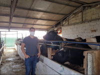 Touring a small family farm before conducting a farmer interview