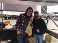 Gifts of pomegranates while conducting surveys at a farmer’s market in Tirana